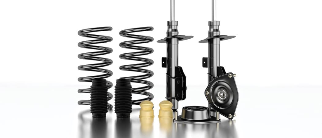 side by side comparison of shocks vs struts