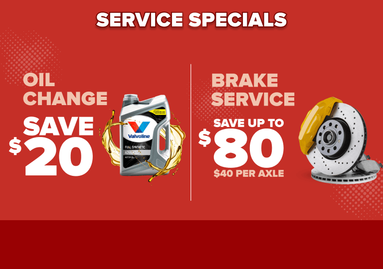 Red promotional banner showing service specials: oil change save $20 with Valvoline bottle, brake service save up to $80 with rotors