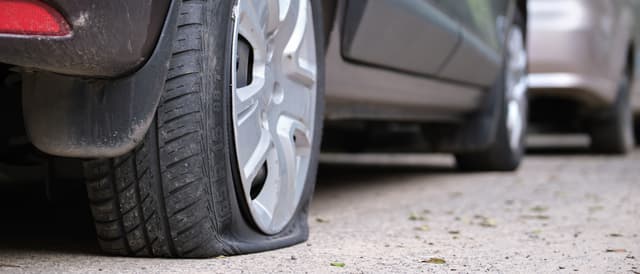 The answer is a resounding no. However, depending on the situation, driving a short distance to a safe area away from traffic or to a repair shop where you can get the flat tire fixed may be necessary. Keep in mind that driving on a flat tire can cause damage to your vehicle and put you and other drivers at risk.